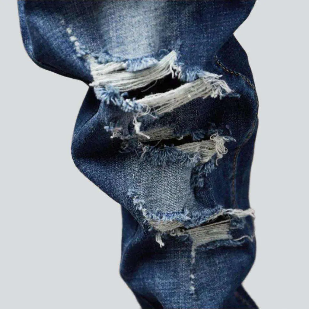 Destroyed blue jeans for men