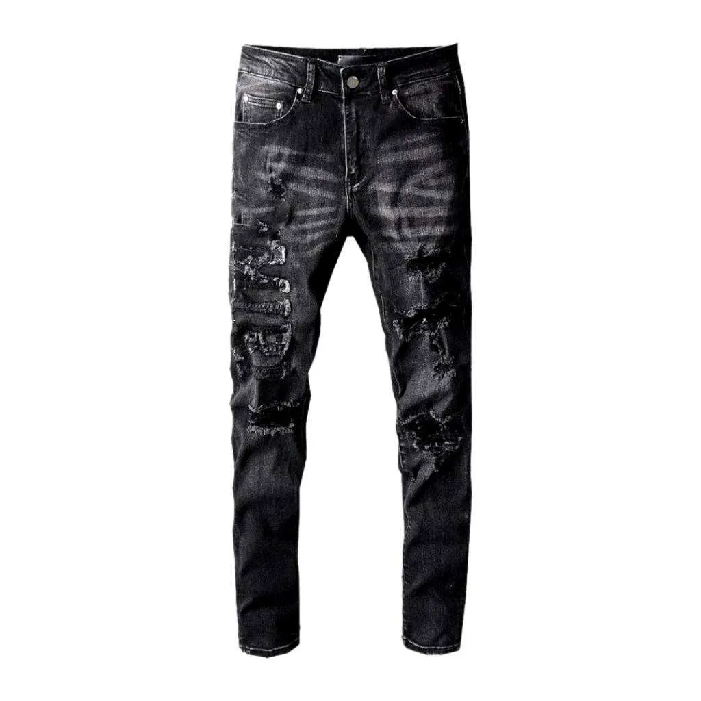 Whiskered distressed black men's jeans