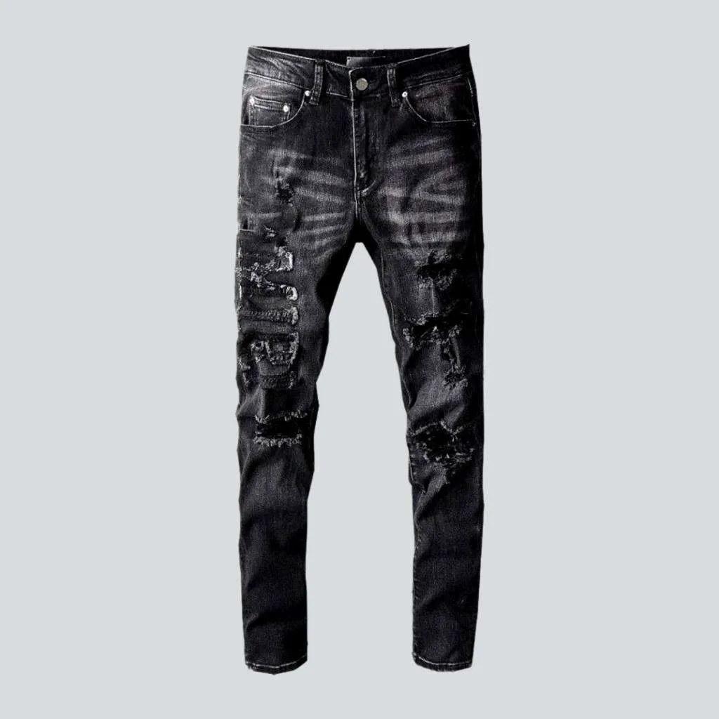 Whiskered distressed black men's jeans